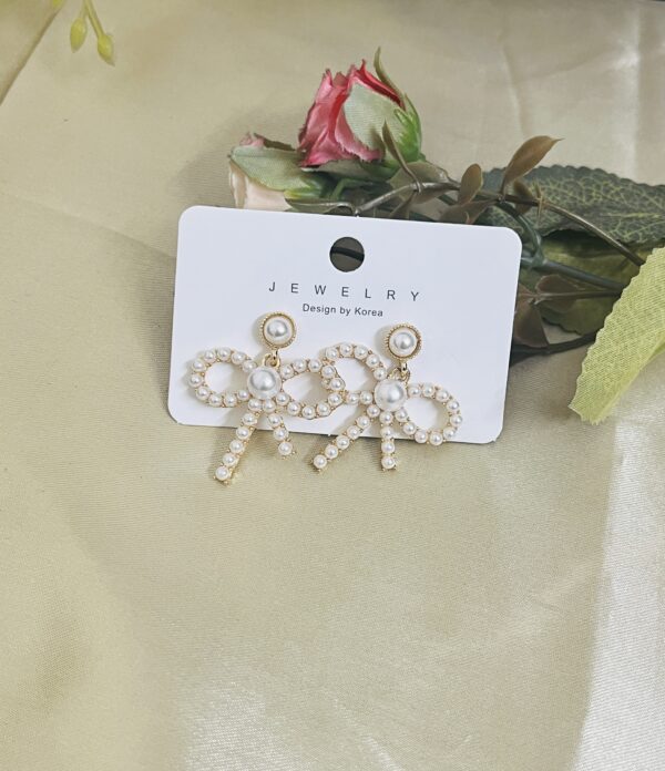 Contemporary hoop bow style earring